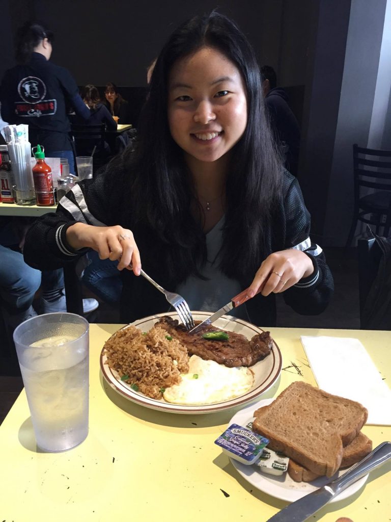 karen eating steak and rice with eggs fork and knife plate