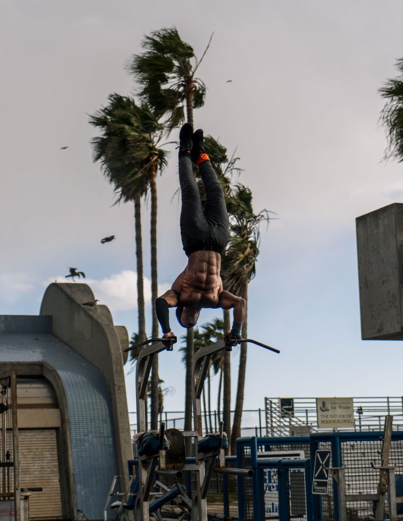 muscle beach really buff guy doing exercises venice los angeles