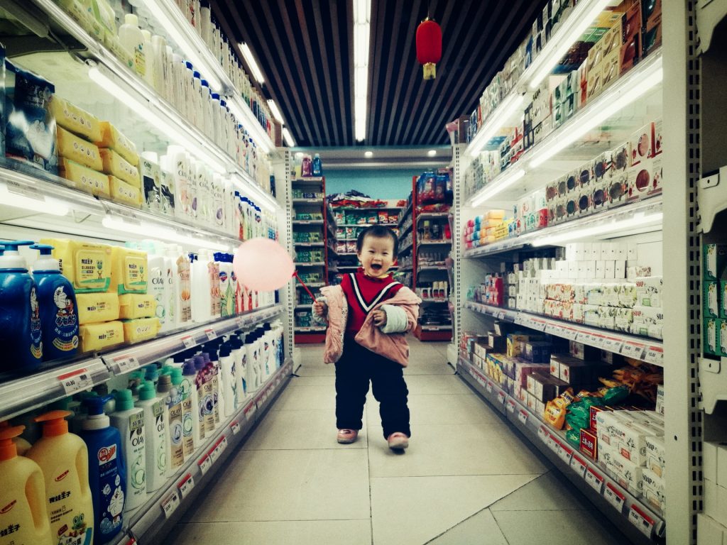 happy kid asian grocery aisle